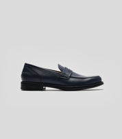 Vegan Loafer - Man, stylish navy shoe featuring blake construction and U-shaped stitched pattern.