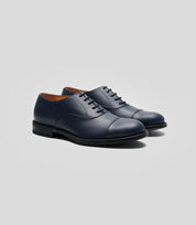 Vegan Oxford - Man shoes showcasing a navy blue smooth upper and classic design, perfect for formal occasions.