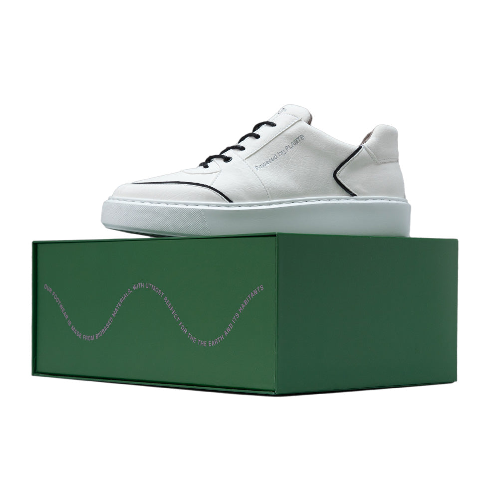 Agazi EMI Low Off-White sustainability shoes displayed on a green box. Environment friendly shoes highlighting commitment to eco-friendly fashion.