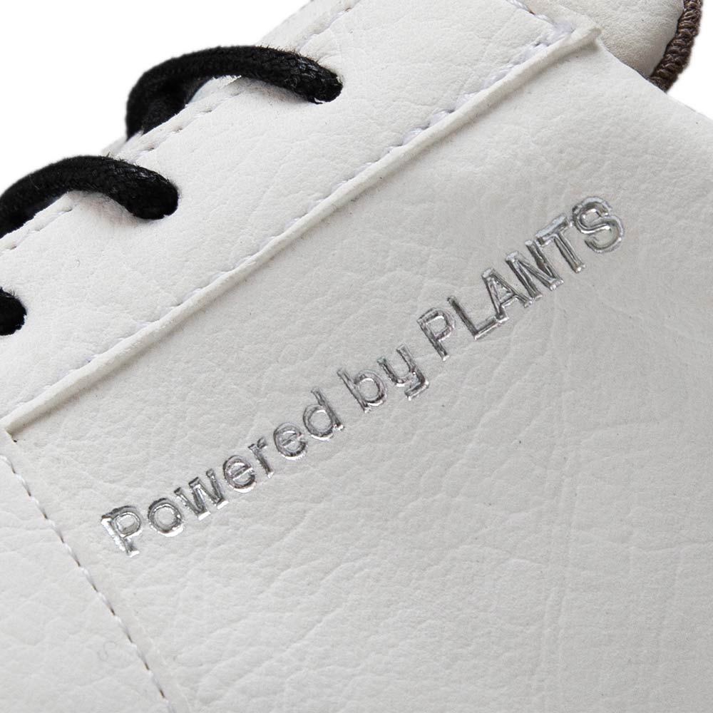 Detail view of Agazi EMI Low Off-White sustainability shoes with 'Powered by Plants' text. Environment friendly shoes emphasizing sustainable materials.