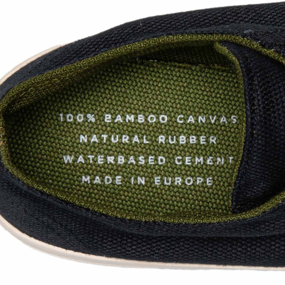 Inside view of Bamburista Low Top GrassHopper Corvino Black sneaker, highlighting the 100% bamboo canvas, natural rubber sole, and water-based cement.