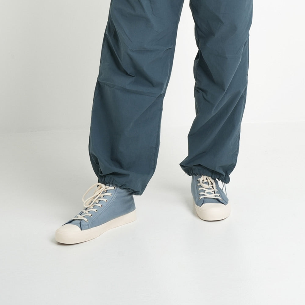 Bamburista GrassHopper Kawasemo Denim sneakers worn with blue pants, demonstrating the stylish and sustainable bamboo fiber textile.