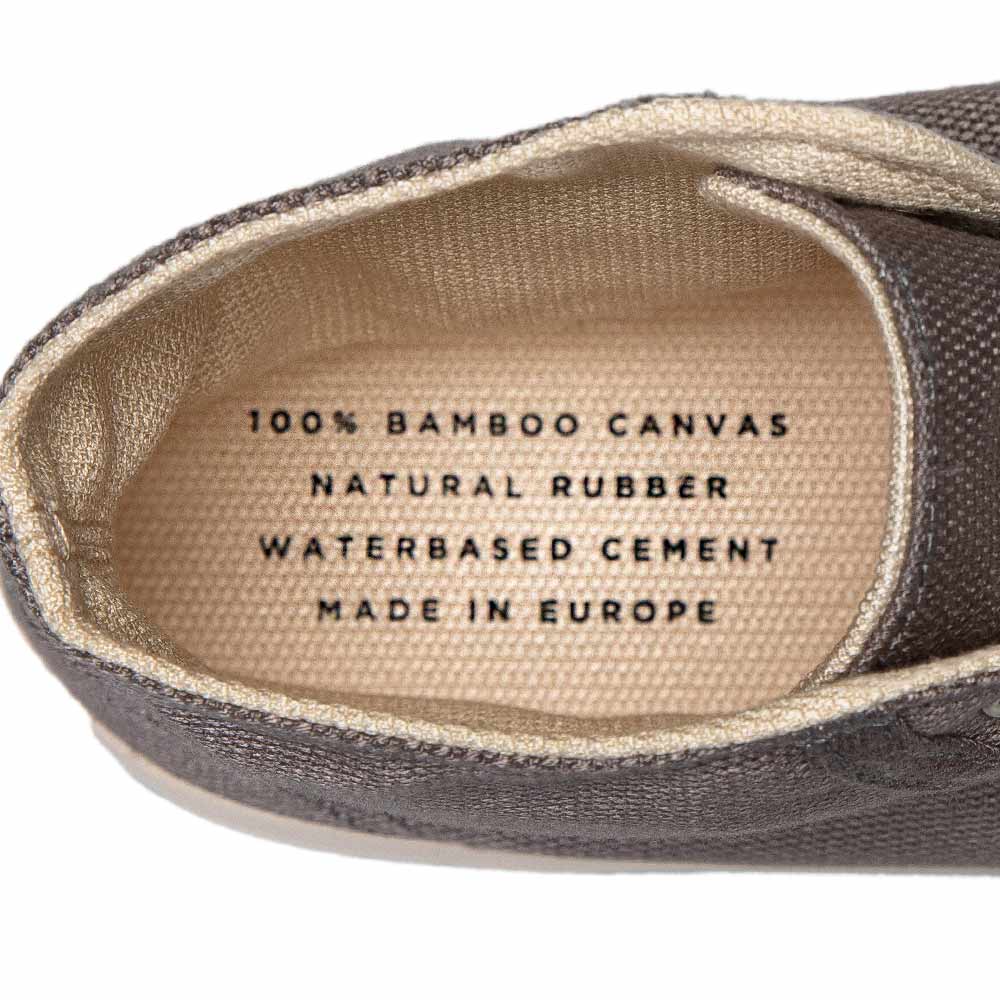 Close-up of the insole of Bamburista GrassHopper Grey high-top sneakers showing the text "100% Bamboo Canvas, Natural Rubber, Waterbased Cement, Made in Europe."