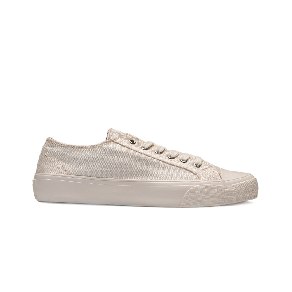 Side view of Bamburista Low Top GrassHopper White Sand sneaker. Showcasing a sleek, sustainable shoe made from bamboo fiber textile with natural rubber soles. Perfect for eco-conscious men.