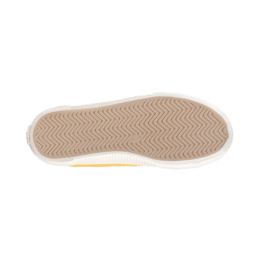 Sole view of Bamburista yellow sneaker, displaying the tread pattern and natural rubber material.