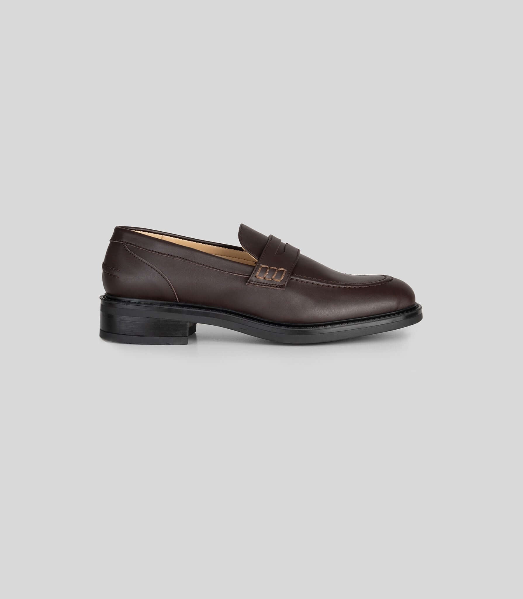 Vegan Loafer - Woman in brown with a distinctive U-shaped pattern and blake construction.