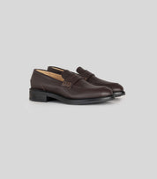 Vegan Loafer - Woman in dark brown with blake construction, versatile for casual or formal outfits.