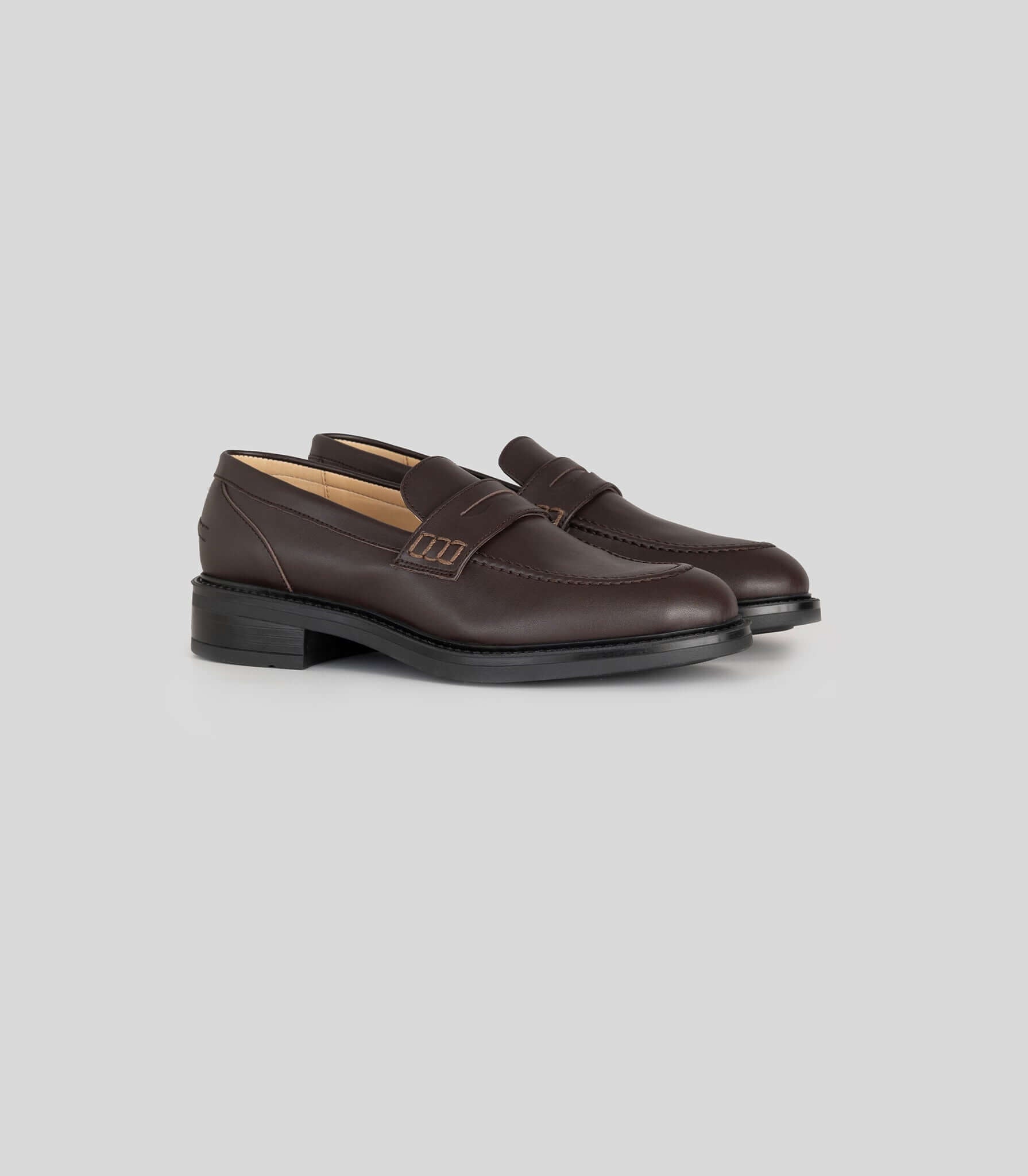 Vegan Loafer - Woman in dark brown with blake construction, versatile for casual or formal outfits.
