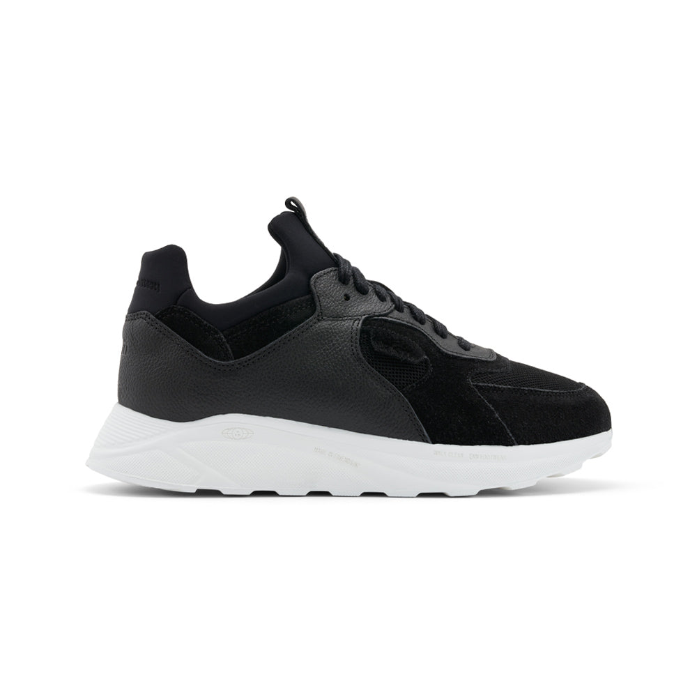 EKN Larch Black Vegan sneakers, side view showcasing sleek design with white sole.