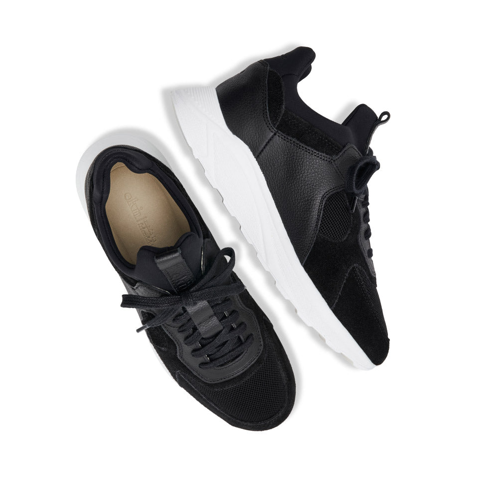 EKN Larch Black Vegan sneakers, top and side view pair showcasing overall look.