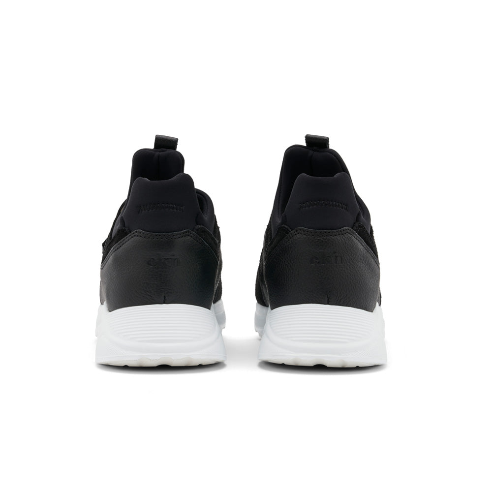 EKN Larch Black Vegan sneakers, rear view highlighting branding and heel design.