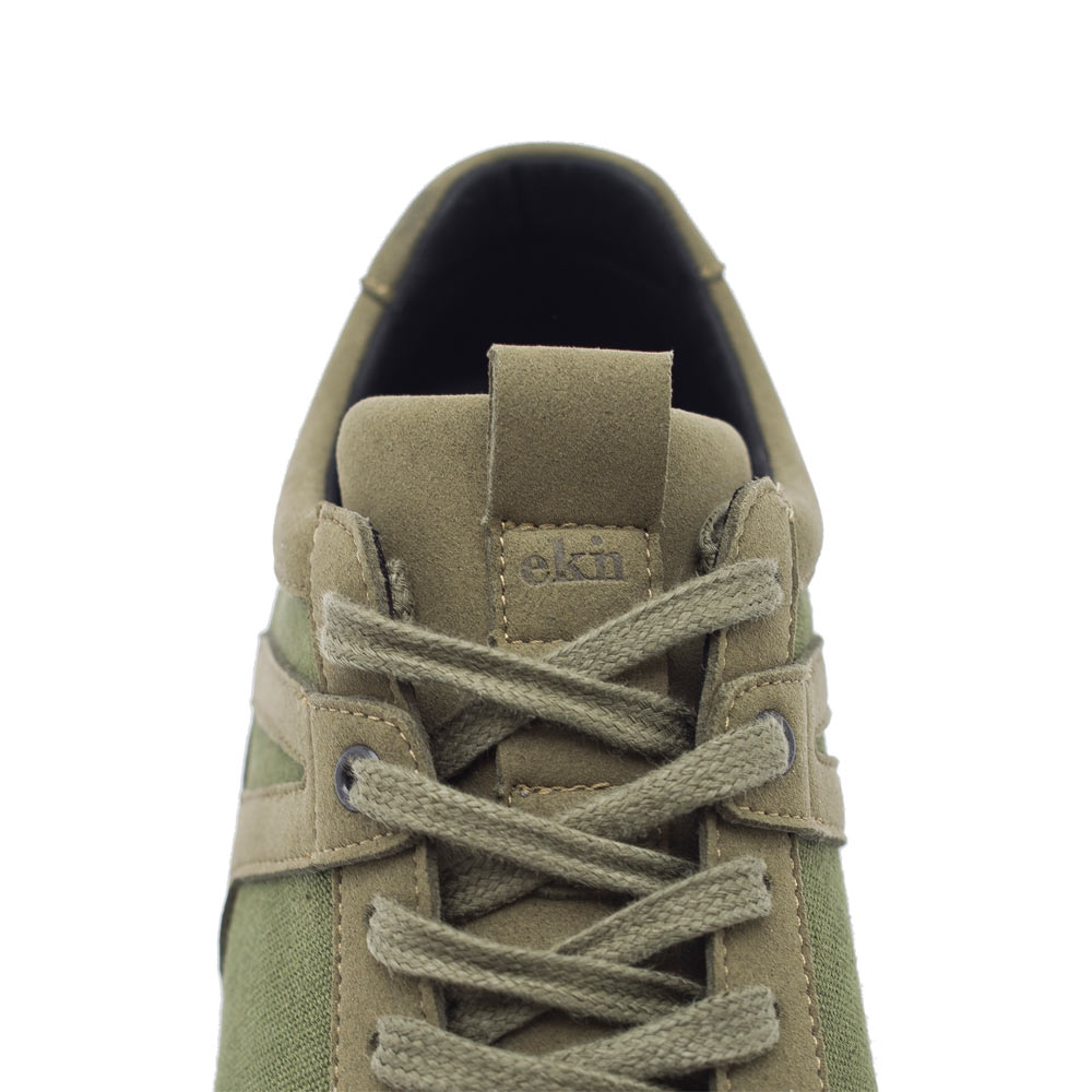 Close-up of laces on EKN Low Seed Runner Artichoke, emphasizing sustainable shoe design.