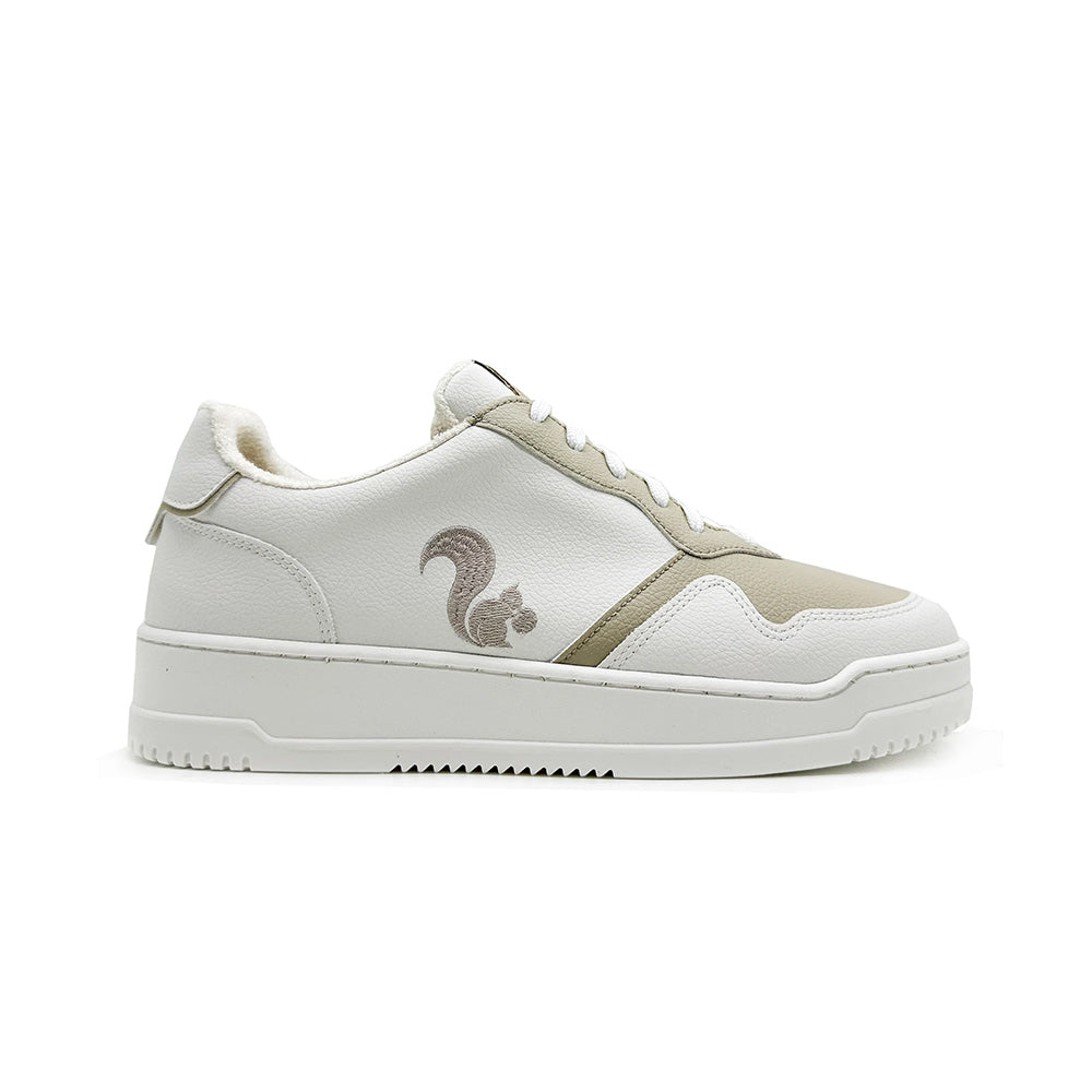 Side view of Thies Eco Cup White for women - sustainable vegan shoes, showcasing the sneaker's stylish design with coral accents and a squirrel logo on the side.