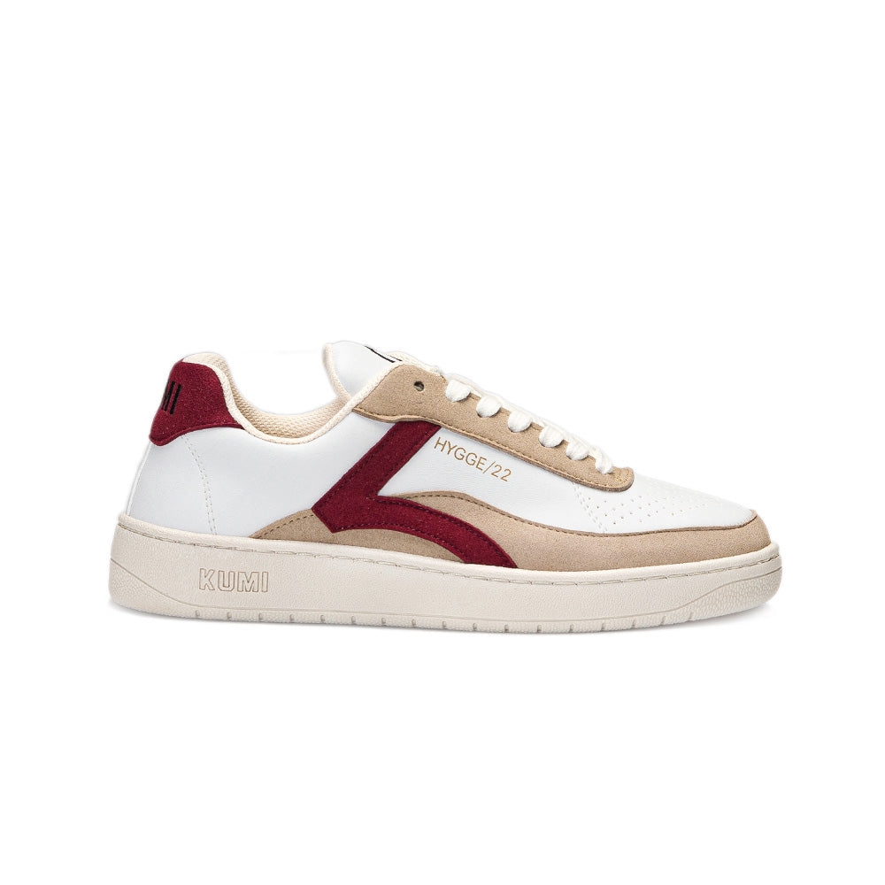 Side view of the Kumi Bordeaux recycled material sneaker, featuring a white upper, beige and Bordeaux accents, and a rubber sole.