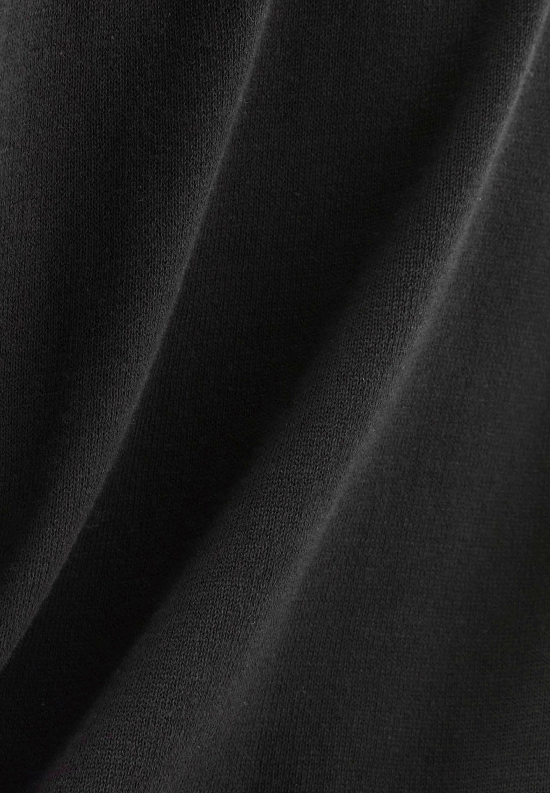 Suéter de punto de algodón orgánico con cuello en V en negro