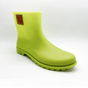 Three-quarter view of Thies Bio Rain Boots in Lime green for women, displaying the vegan boots' elegant design.