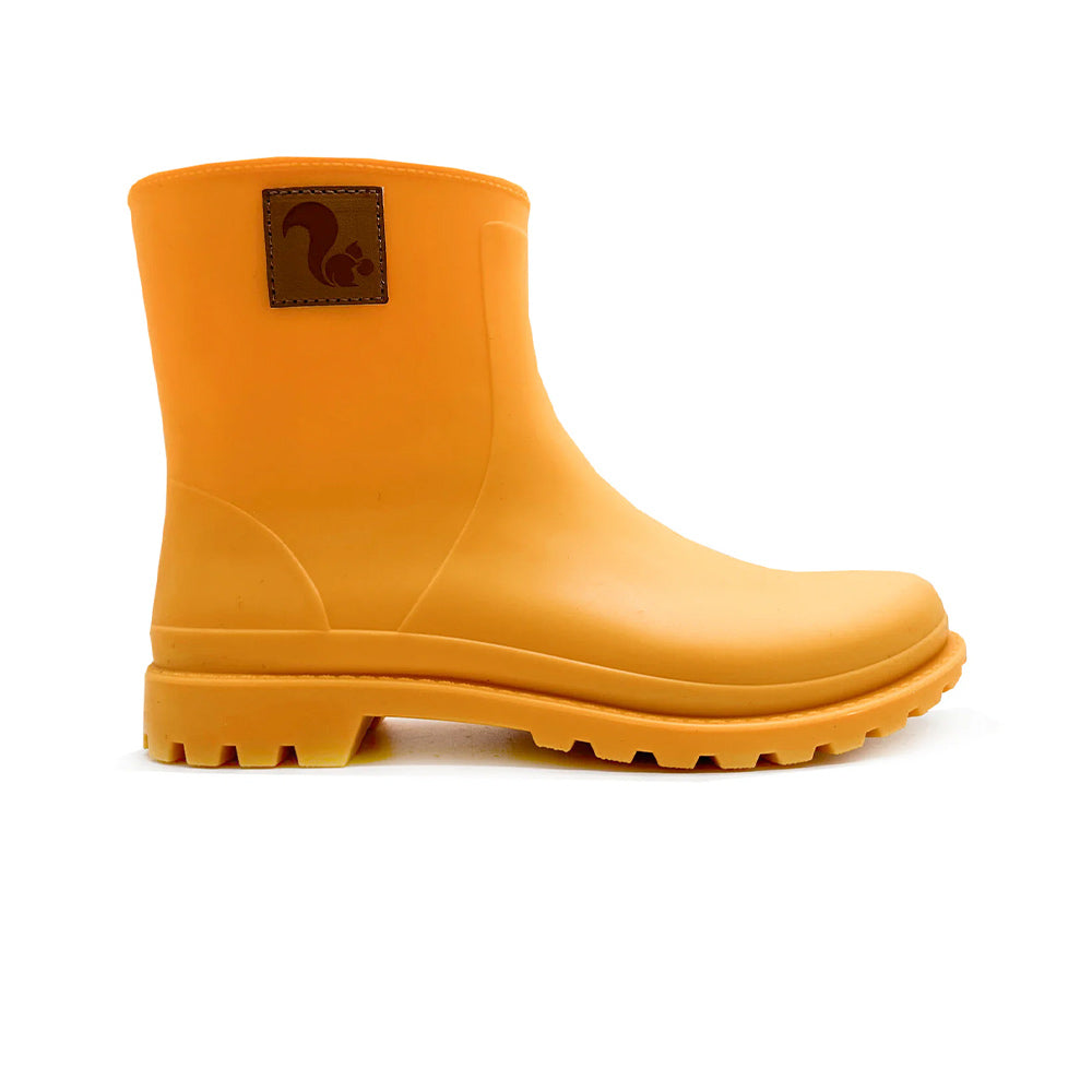 Side view of Thies Bio Rain Boots in Orange, for women, showcasing the vegan boots sturdy design.