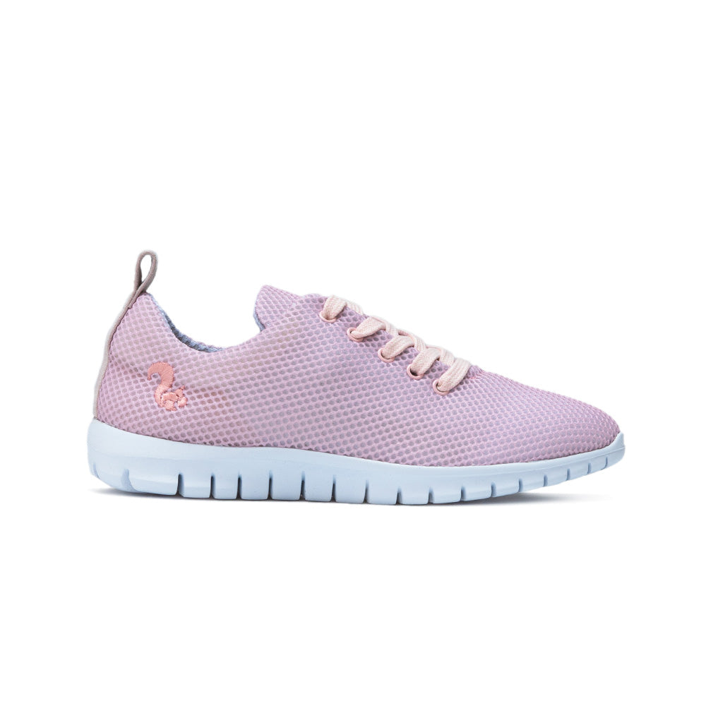 Side view of the pink Thies sustainable sneaker, featuring a mesh upper and white flexible sole.