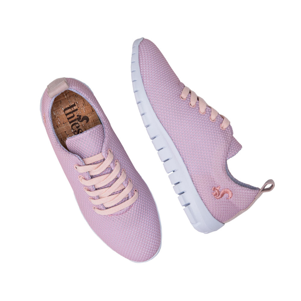 Top view of the pink Thies sustainable sneaker, highlighting its mesh upper and cork insole.