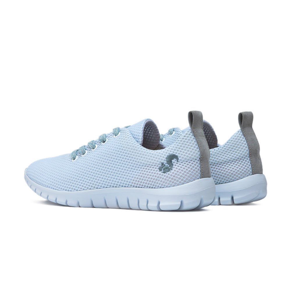 Back view of the sky blue Thies sustainable sneakers, showing the grey pull tab and heel details.