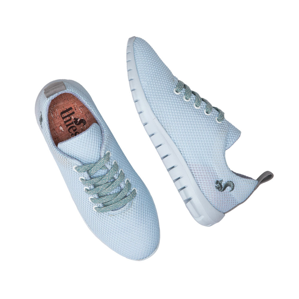 Top view of the sky blue Thies sustainable sneaker, highlighting its mesh upper and cork insole.