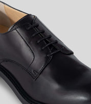 Vegan Derby - Woman black shoe with open lacing system and Blake Construction detail.