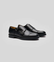 Vegan Monk Strap - Man in black leather with Blake construction, perfect for the modern gentleman.